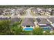High aerial view of the backyard swimming pool, property lines and surrounding neighborhood at 3845 Arborvitae Way, Deland, FL 32724