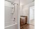 Bathroom featuring a tub and shower with a wood vanity and granite countertop at 3845 Arborvitae Way, Deland, FL 32724