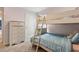 Shared bedroom with soft carpet, bunkbeds, a gray dresser, and ample natural light at 3845 Arborvitae Way, Deland, FL 32724