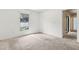 Cozy bedroom featuring carpet floors, a window, and neutral walls at 3845 Arborvitae Way, Deland, FL 32724