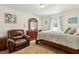 Comfortable bedroom features carpeted floors, white walls, a dresser with a mirror, and plenty of natural light at 3845 Arborvitae Way, Deland, FL 32724