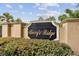 Berry's Ridge community sign in gold lettering and manicured shrubbery beneath under a blue sky at 3845 Arborvitae Way, Deland, FL 32724