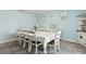 Bright dining room features modern decor, seating for eight and natural light at 3845 Arborvitae Way, Deland, FL 32724