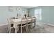 This dining room features decor, light blue walls, and seating for eight at 3845 Arborvitae Way, Deland, FL 32724