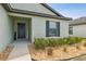 Charming home featuring a stylish entry and a well manicured landscape at 3845 Arborvitae Way, Deland, FL 32724