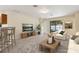Inviting living room featuring modern furniture and decor and access to the outdoor pool area at 3845 Arborvitae Way, Deland, FL 32724