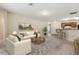 Open concept living room featuring breakfast bar and comfortable furniture at 3845 Arborvitae Way, Deland, FL 32724