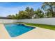 A beautiful in-ground pool with water features and fountains surrounded by a white fence at 3845 Arborvitae Way, Deland, FL 32724