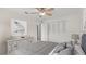 This stylish bedroom is staged with coastal-inspired decor at 411 N Halifax Ave # 304, Daytona Beach, FL 32118
