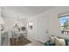 Bright dining area featuring a dining table with a nearby serving bar and open to the living room at 411 N Halifax Ave # 304, Daytona Beach, FL 32118