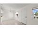 Dining room space featuring bright windows, neutral walls, and tile flooring open to the living space at 411 N Halifax Ave # 304, Daytona Beach, FL 32118