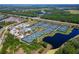 An aerial view of the expansive Florida Tennis Center, offering multiple courts and lush surrounding landscaping at 418 Aquamarine Way, Daytona Beach, FL 32124