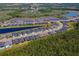 Community aerial view showcasing the neighborhood layout, nearby lakes, and the Florida Tennis Center at 418 Aquamarine Way, Daytona Beach, FL 32124