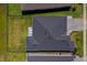 Birds-eye view of a home showing the roof, fenced backyard, a small patio with chairs, and well-maintained landscaping at 418 Aquamarine Way, Daytona Beach, FL 32124