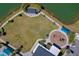 Aerial perspective of the playground and lawn area set along the lake. Includes picnic pavilion and walking trails at 418 Aquamarine Way, Daytona Beach, FL 32124