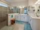 Bright bathroom with a glass enclosed shower, dual vanity, and modern finishes at 418 Aquamarine Way, Daytona Beach, FL 32124