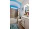 Well-lit bathroom with tub-shower combination and modern vanity at 418 Aquamarine Way, Daytona Beach, FL 32124