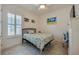 Comfortable bedroom featuring natural light, a stylish bed, and tiled floors at 418 Aquamarine Way, Daytona Beach, FL 32124