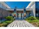 Welcoming entrance to the community clubhouse, showcasing elegant design and a tranquil view of the amenities beyond at 418 Aquamarine Way, Daytona Beach, FL 32124