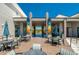 Inviting patio with comfortable seating and tables, perfect for relaxing and enjoying the community amenities at 418 Aquamarine Way, Daytona Beach, FL 32124