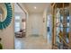 Welcoming foyer featuring tile flooring, arched doorways, and stylish decor, offering an elegant and inviting entrance to the home at 418 Aquamarine Way, Daytona Beach, FL 32124