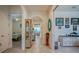 Bright hallway featuring tile floors, archways and stylish decorations at 418 Aquamarine Way, Daytona Beach, FL 32124