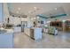 Open-concept kitchen with island seating that flows into the bright living room at 418 Aquamarine Way, Daytona Beach, FL 32124