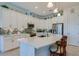 Bright kitchen featuring a center island, stainless steel appliances, and white cabinetry at 418 Aquamarine Way, Daytona Beach, FL 32124
