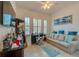 Bright home office featuring a comfortable seating area and built-in desk at 418 Aquamarine Way, Daytona Beach, FL 32124
