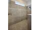 Modern tiled shower with glass enclosure and stylish fixtures at 418 Aquamarine Way, Daytona Beach, FL 32124