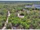 Stunning aerial view of a secluded home surrounded by lush greenery at 4600 S Tomoka Dr, De Leon Springs, FL 32130