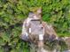 Overhead shot of a house featuring a modern roofline and private setting at 4600 S Tomoka Dr, De Leon Springs, FL 32130