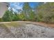 Expansive backyard offers privacy with surrounding lush trees at 4600 S Tomoka Dr, De Leon Springs, FL 32130