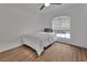 Bedroom featuring hardwood floors and a bright window with natural light at 4600 S Tomoka Dr, De Leon Springs, FL 32130