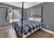 Bedroom with window for natural light, neutral paint and wood floors at 4600 S Tomoka Dr, De Leon Springs, FL 32130