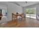 Cozy dining area featuring a wooden table and a sliding glass door to the exterior at 4600 S Tomoka Dr, De Leon Springs, FL 32130
