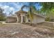 Inviting single-story home with a well-manicured yard and landscaping at 4600 S Tomoka Dr, De Leon Springs, FL 32130