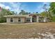 Charming one-story home featuring a well-maintained lawn and a welcoming front porch at 4600 S Tomoka Dr, De Leon Springs, FL 32130