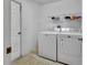 Functional laundry room with a washing machine and dryer at 4600 S Tomoka Dr, De Leon Springs, FL 32130