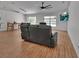 Spacious living room with wood floors, large windows, and contemporary furnishings at 4600 S Tomoka Dr, De Leon Springs, FL 32130