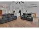 Open concept living area featuring modern furnishings and wood flooring at 4600 S Tomoka Dr, De Leon Springs, FL 32130