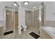 Main bathroom with tiled floors, double sinks, walk-in shower, and garden tub at 4600 S Tomoka Dr, De Leon Springs, FL 32130