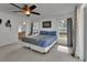 Spacious main bedroom with ceiling fan, natural light, and ensuite bathroom at 4600 S Tomoka Dr, De Leon Springs, FL 32130