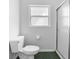 Fresh bathroom featuring shower with sliding glass door, toilet, and window for natural light at 484 Sherwood Oaks Rd, Orange City, FL 32763