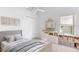 Charming bedroom with neutral tones, ceiling fan, and delightful built-in shelving and storage at 484 Sherwood Oaks Rd, Orange City, FL 32763