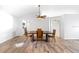 Dining area featuring wood floors and ample natural light at 484 Sherwood Oaks Rd, Orange City, FL 32763
