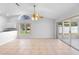 Bright living space with tile floors, large windows, and sliding glass doors to lanai at 484 Sherwood Oaks Rd, Orange City, FL 32763