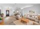 Open-concept living area featuring a dining area with modern furnishings at 484 Sherwood Oaks Rd, Orange City, FL 32763
