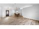 Living space featuring an entrance, dining area and wood floors at 484 Sherwood Oaks Rd, Orange City, FL 32763
