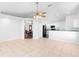 Open-concept living space with tile floors connects living, dining, and kitchen areas at 484 Sherwood Oaks Rd, Orange City, FL 32763